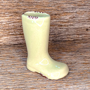 Use these adorable boots as a vase for small fresh cuts from your garden. They can be used as a planter for little indoor plants. Or use them as an accent in your table display!